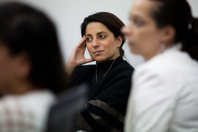 Haas EMBA student Danielle Dudum listens to a presentation at Identify3D in San Francisco - Ethan Baron photo