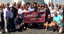 A recent graduating class of EMBA students from Fordham University's Gabelli School of Business
