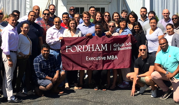 A recent graduating class of EMBA students from Fordham University's Gabelli School of Business